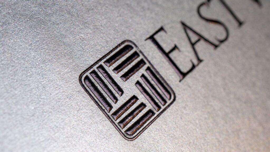 close-up of the black foil with deboss finish on the logo